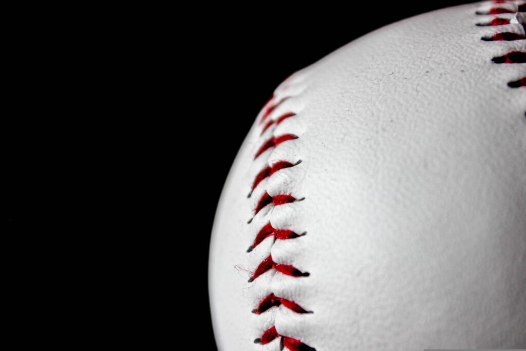 Close-up of baseball with red stitching
