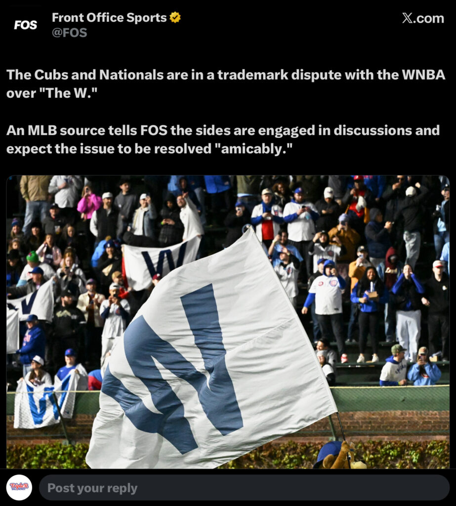 Chicago Cubs fans wave a large W flag